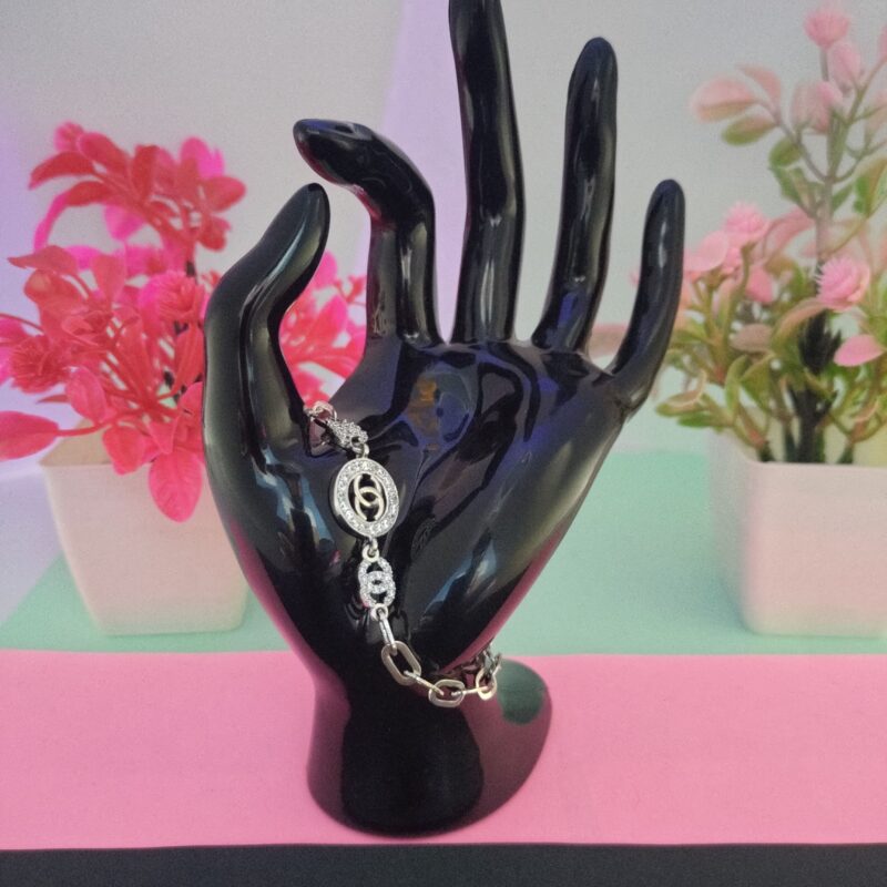 Modern silver bracelet with linked ring design