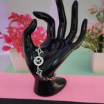 Polished silver chain bracelet with geometric details