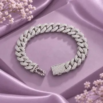 Men's chunky silver link bracelet displayed on purple satin
